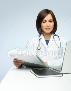 Female doctor sitting at computer